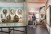 Bezoekers bekijken interactieve borden en kaartmateriaal in de tentoonstelling Bestemming Havenstad in het Maritiem Museum Rotterdam, met focus op havenontwikkeling.